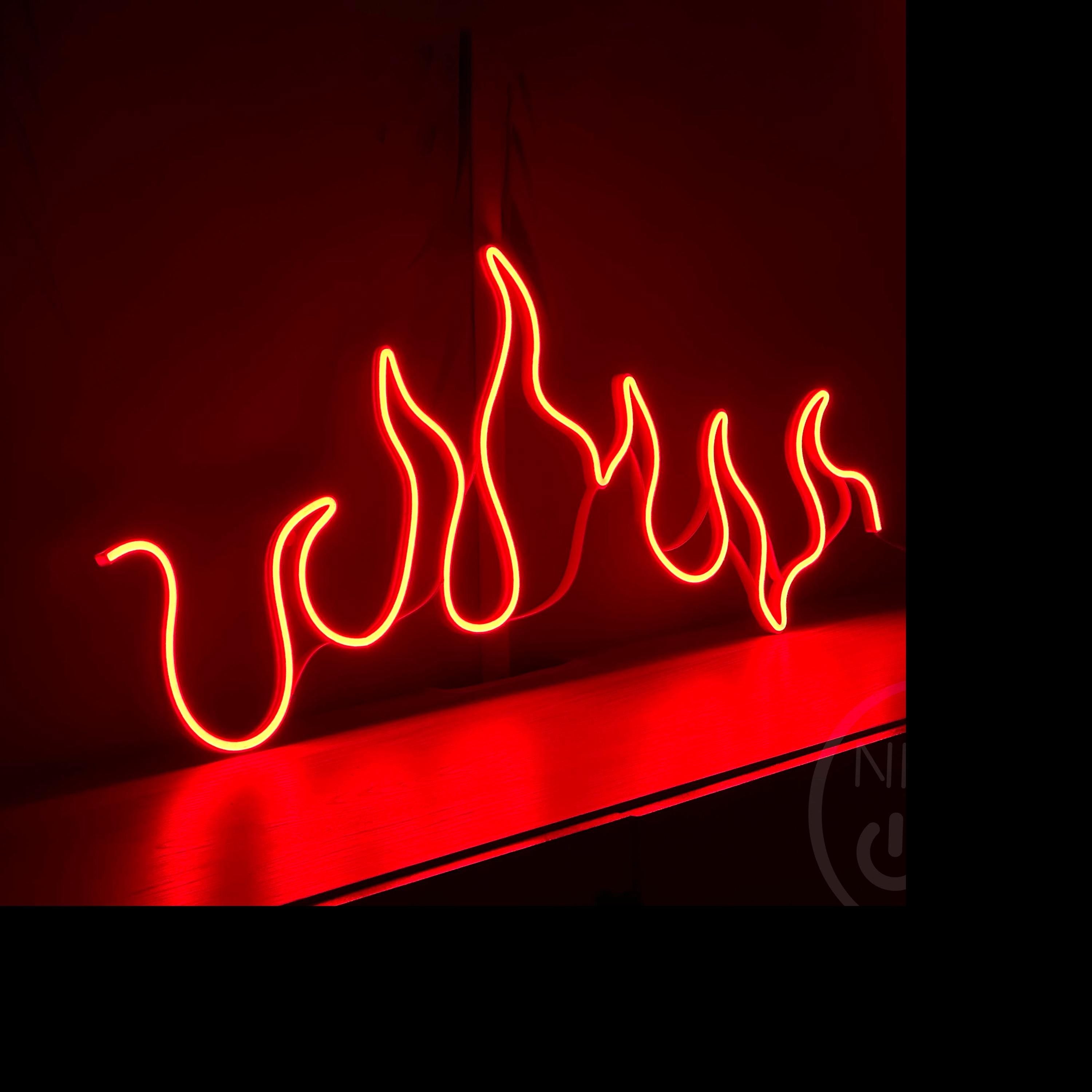 a red neon sign with flames on it