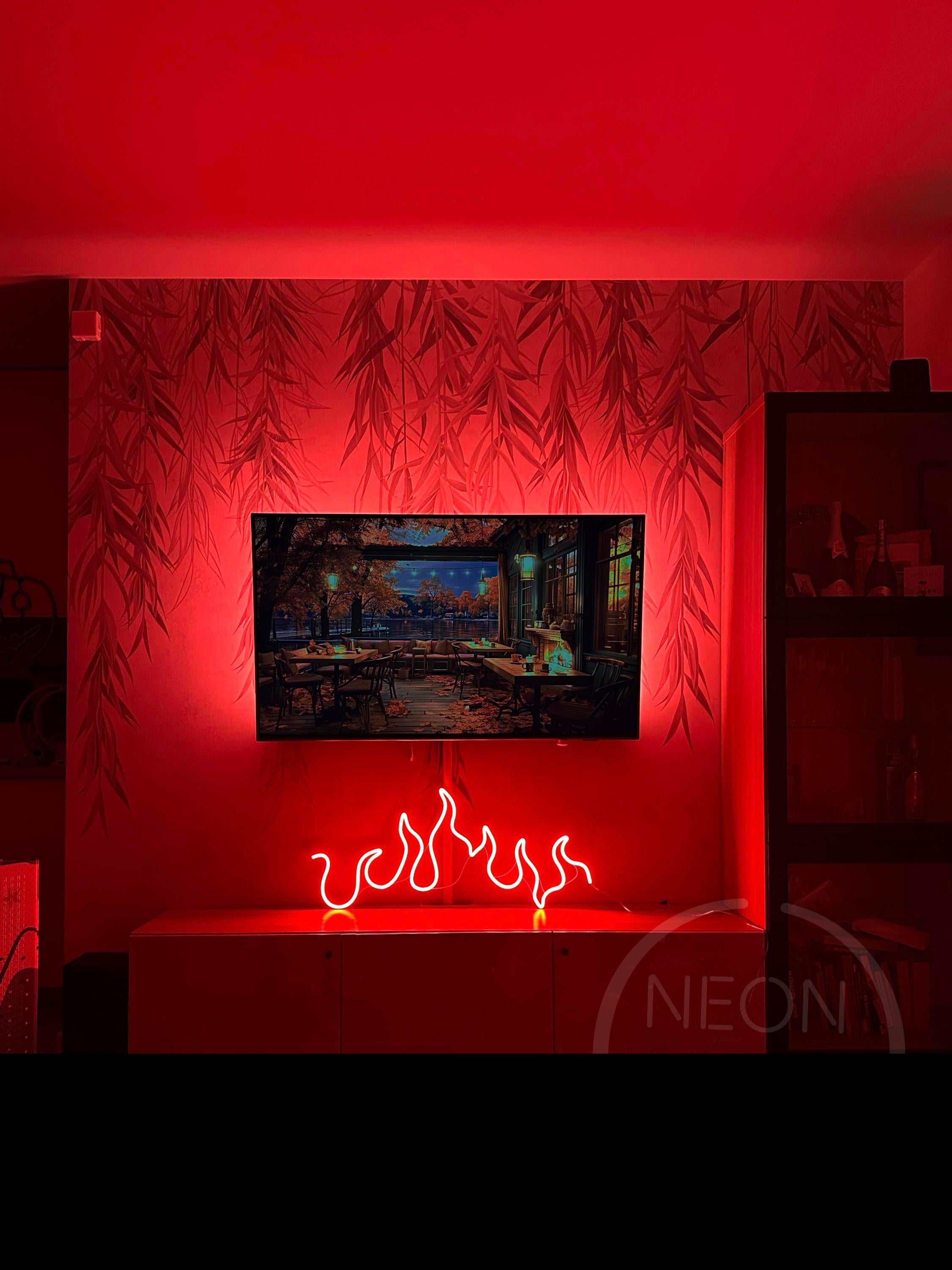 a red room with a television and a fire place