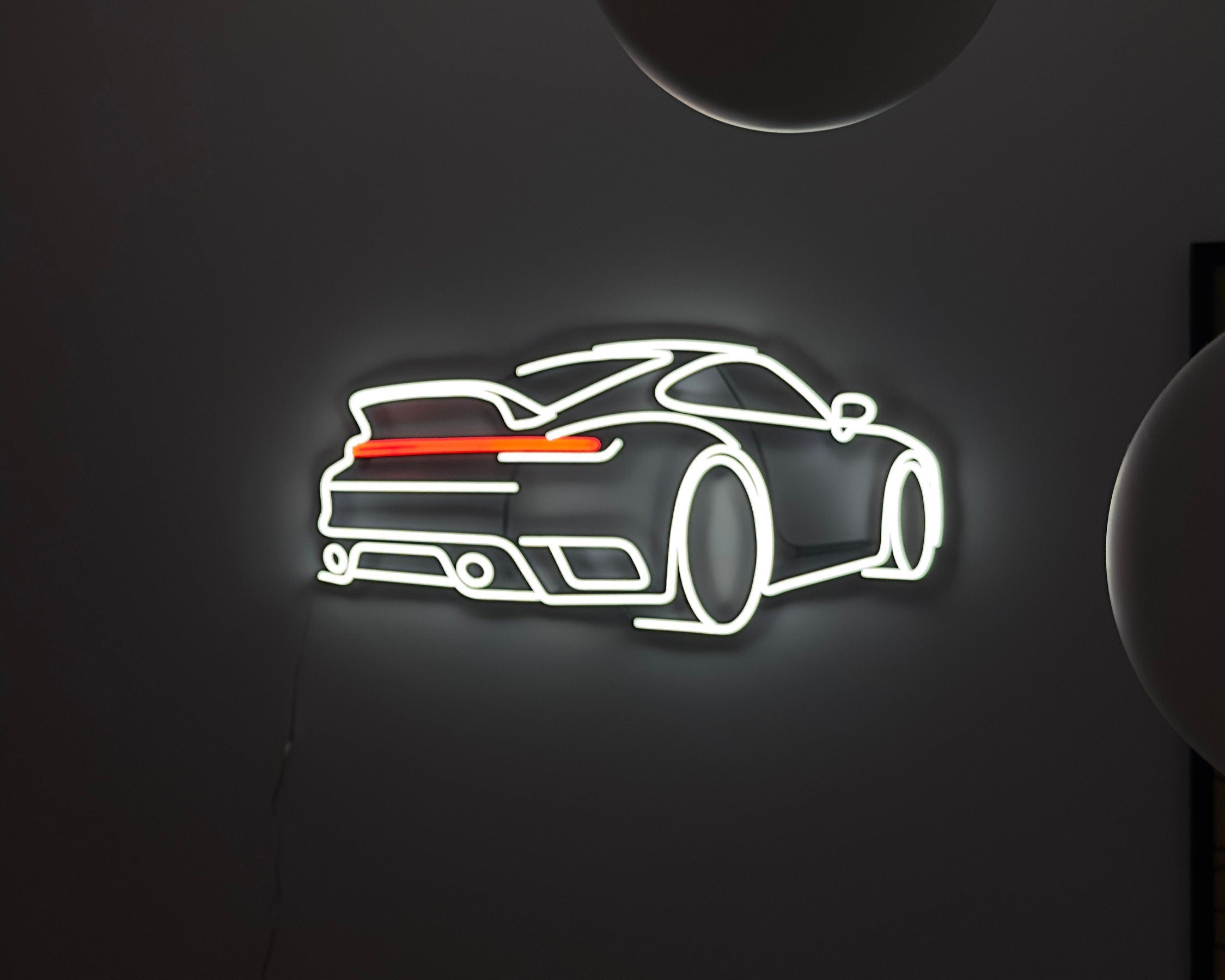 LED neon sign depicting a Porsche 911 sports car