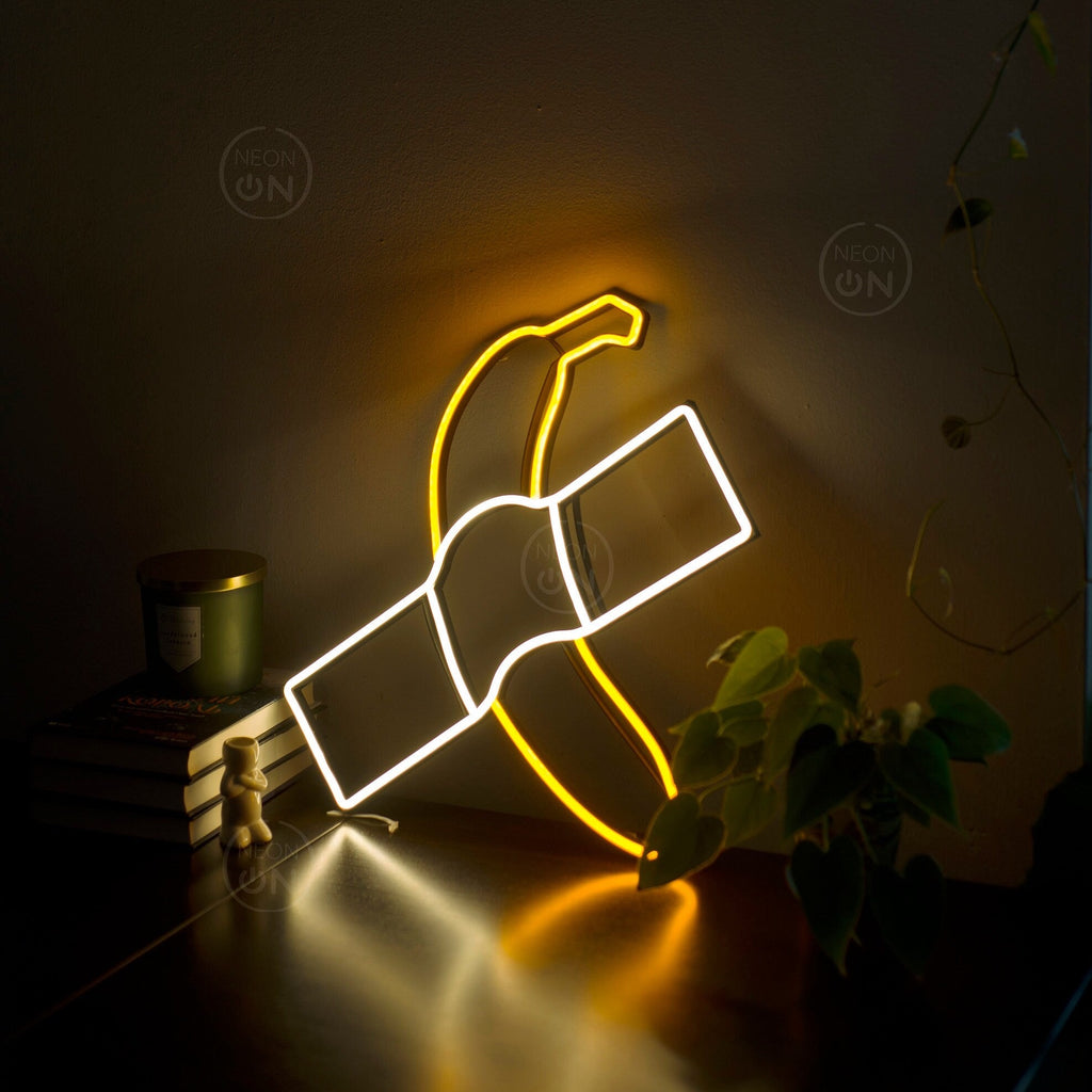 Banana taped to a wall neon sign - Neonon